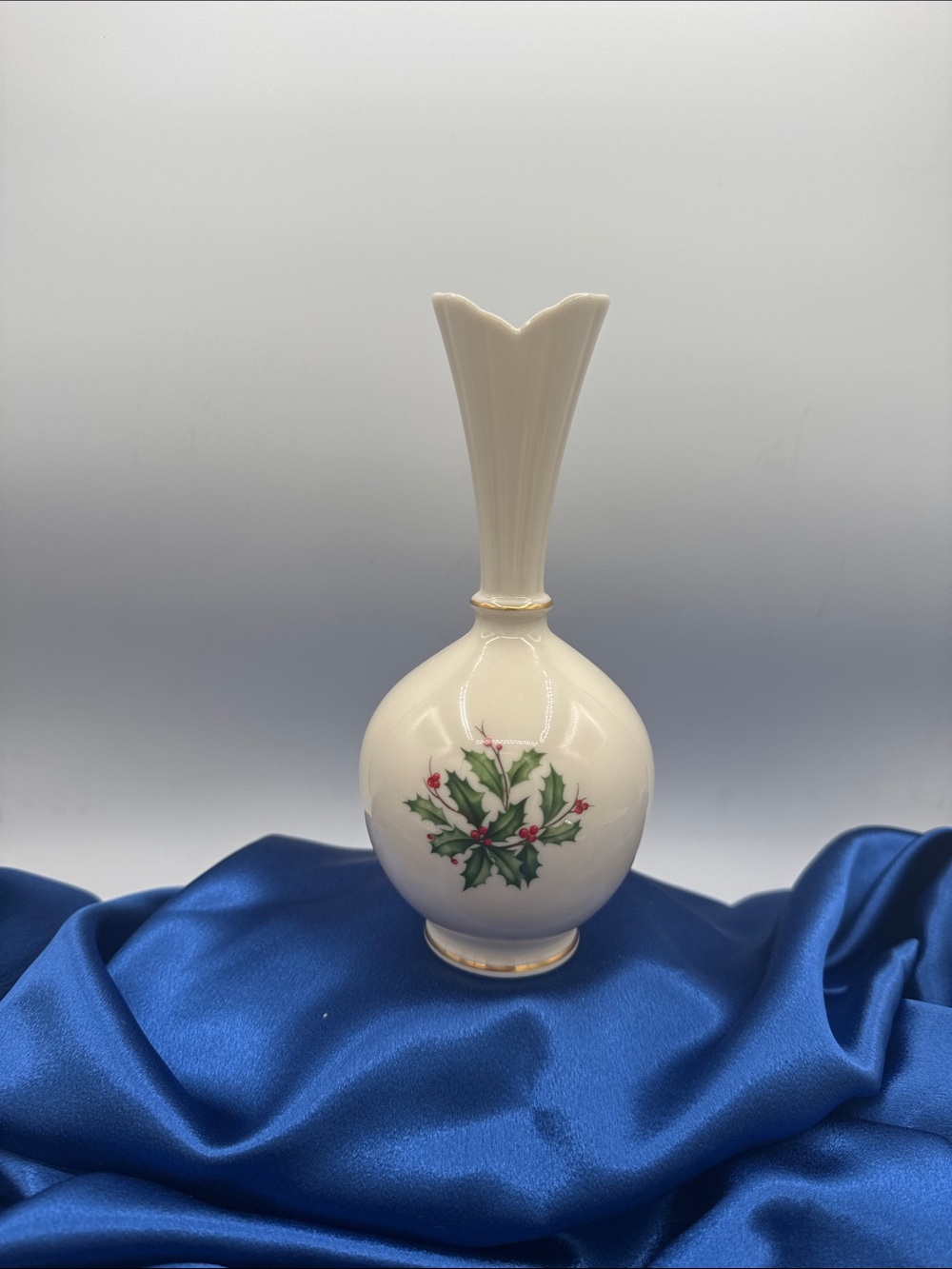 Lenox Holiday ivory porcelain high bulbous bud vase featuring gold accents.